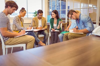 team chatting in business meeting