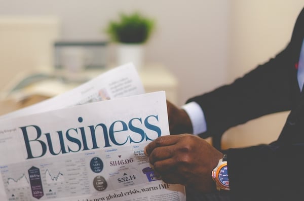 Business man reading paper