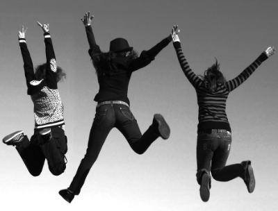 Black and White picture of three girls jumping in the air