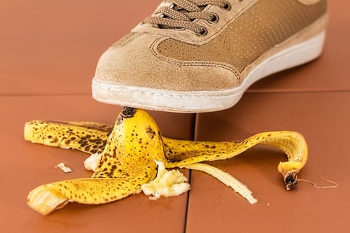 Man about to step on banana peel