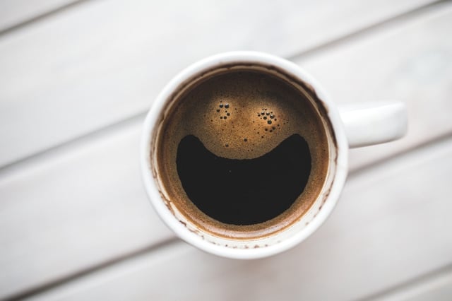 Coffee cup with smile in froth