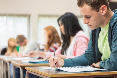 students writing notes in class