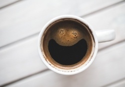 Coffee cup from above with smiley face