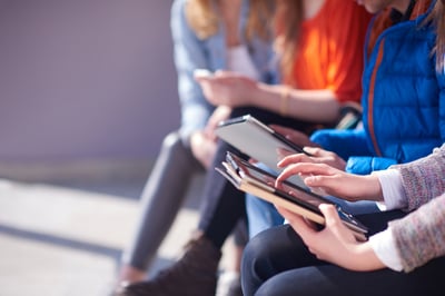 person working on tablet outdoors