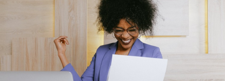 Woman successfully completing training reviewing learning materials