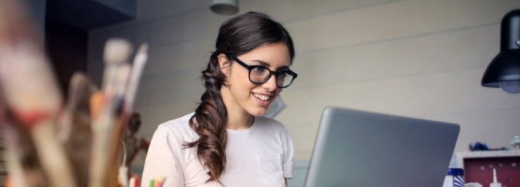 Woman participating in online training via webinar delivery