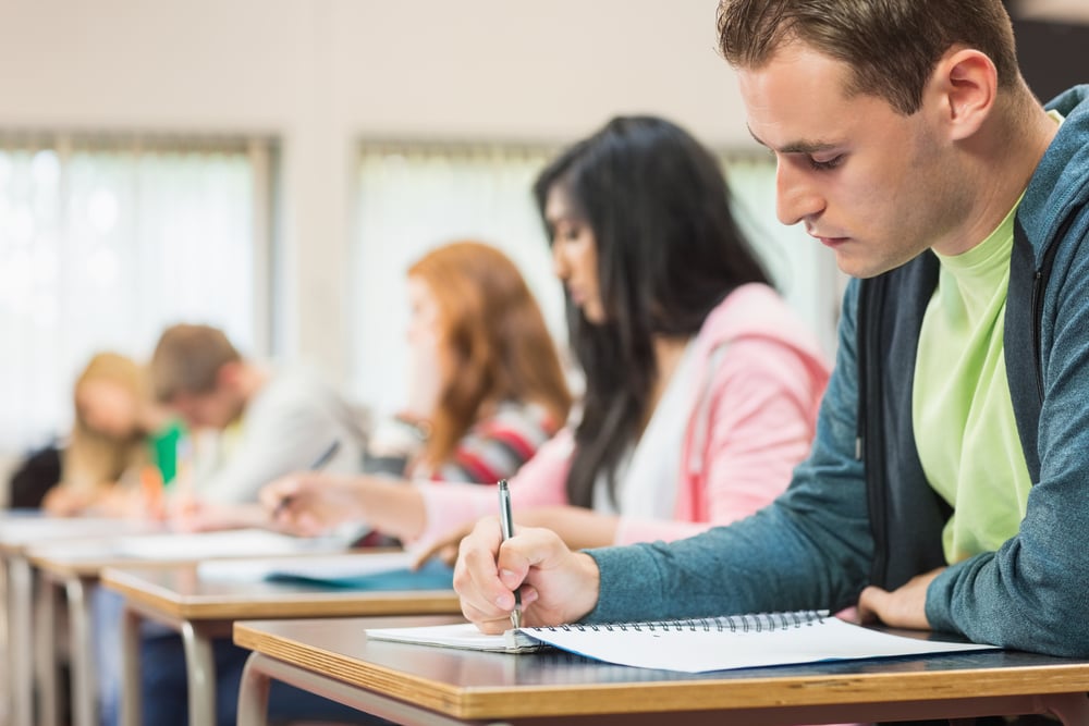 students writing notes in class